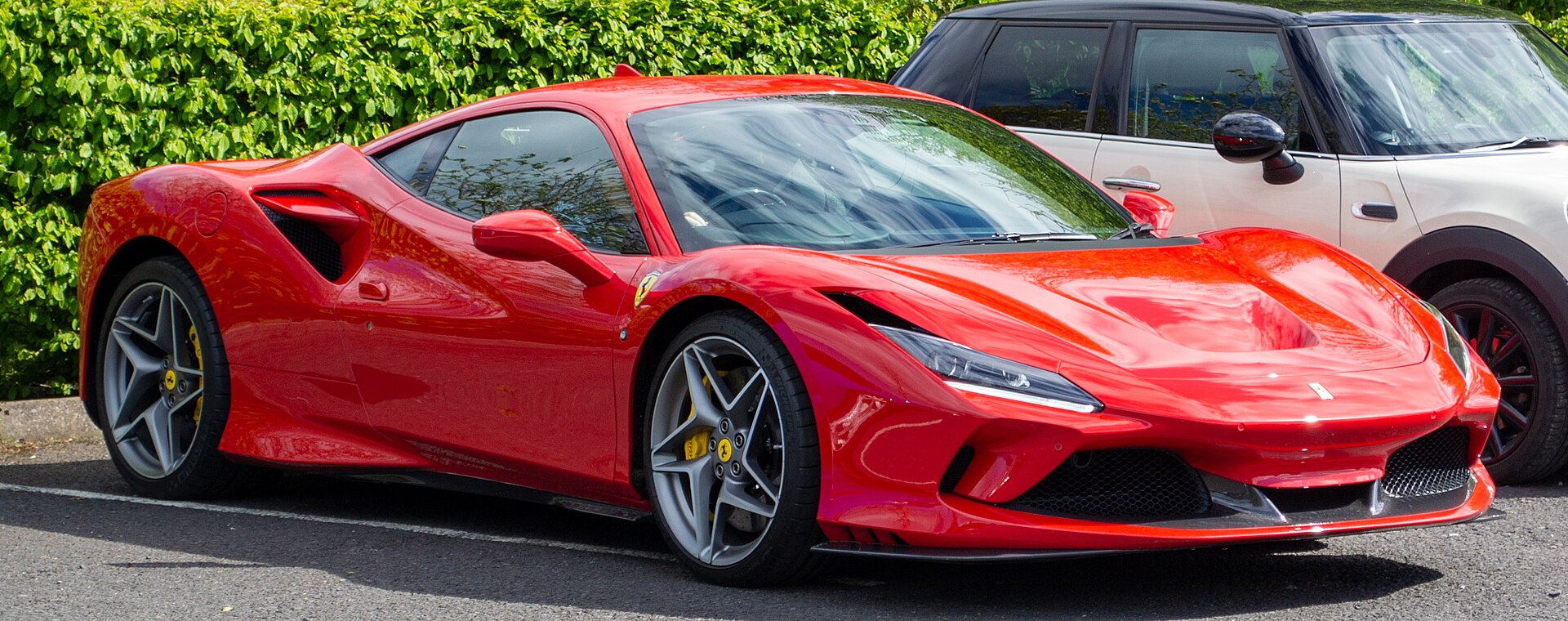 Entire red Ferrari F8 shown from the front three-quarter view